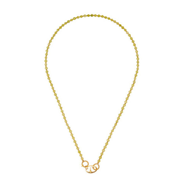 a necklace with alternating Vessionite stones and a gold-plated bead with an oval lock for woman