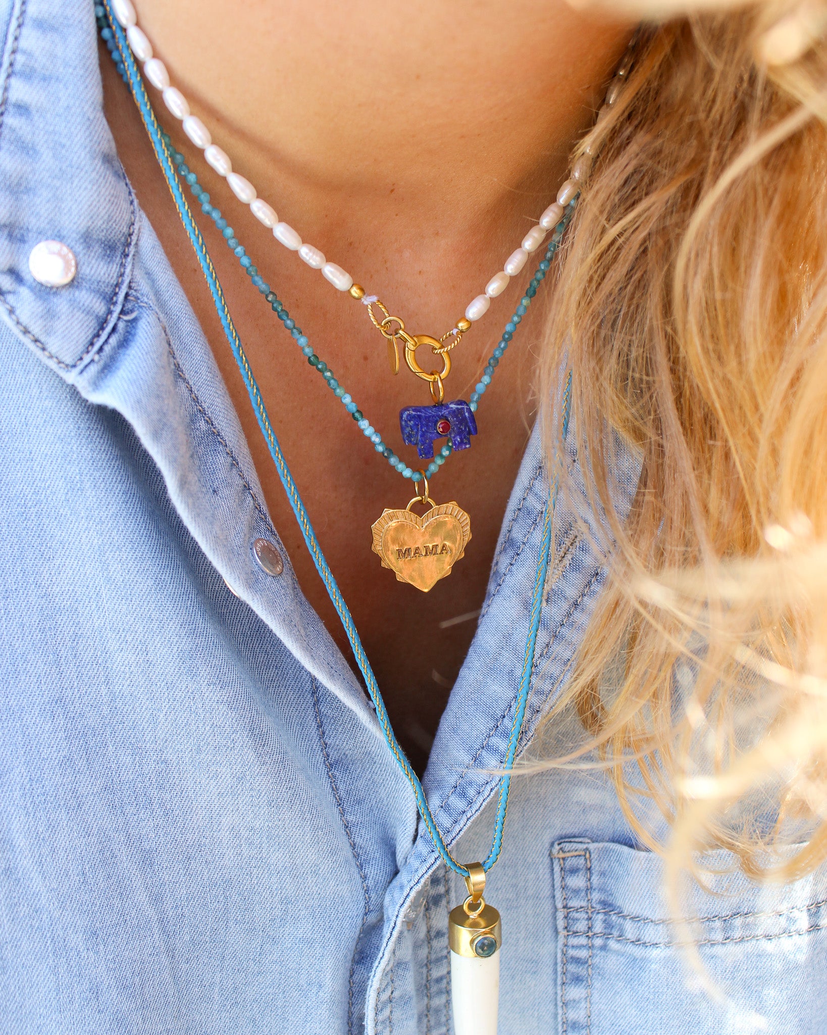 Parelketting met paardje bedel