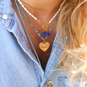 Parelketting met paardje bedel